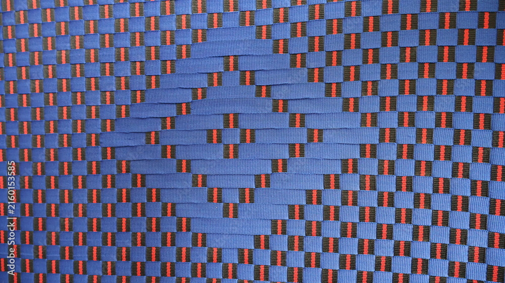 Фотография Blue and red woven geometric pattern