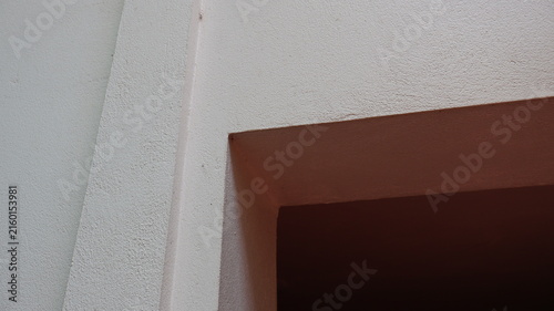 Abstract architectural corner with textured wall