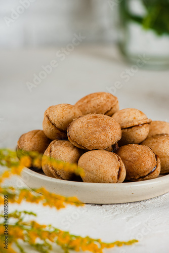 Homemade plant based cookies with coconut condensed milk, healthy sugar and gluten free dessert with coffee. Vertical orientation.