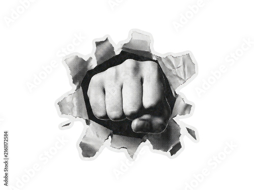 Clenched fist breaking through a distressed paper tear effect with halftone texture