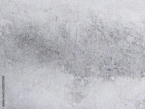 Gray concrete wall texture with weathered plaster surface building construction