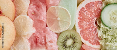 Fresh pink grapefruit and lemon slices in a soft pastel still life, perfect for food, summer, citrus, wellness, kitchen, recipe, and healthy lifestyle.