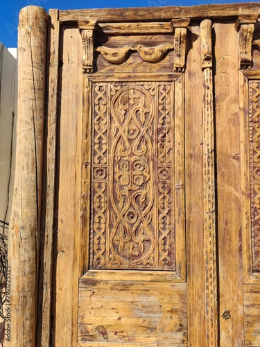 old vintage wooden door. ancient wooden door against. ancient natural wood background