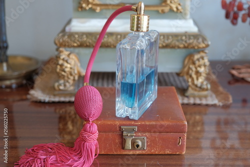 vintage perfume with atomizer. antiques on the table