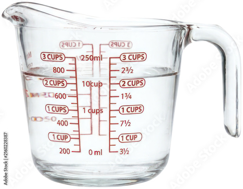 Fotografía Glass measuring cup filled with clear water.
