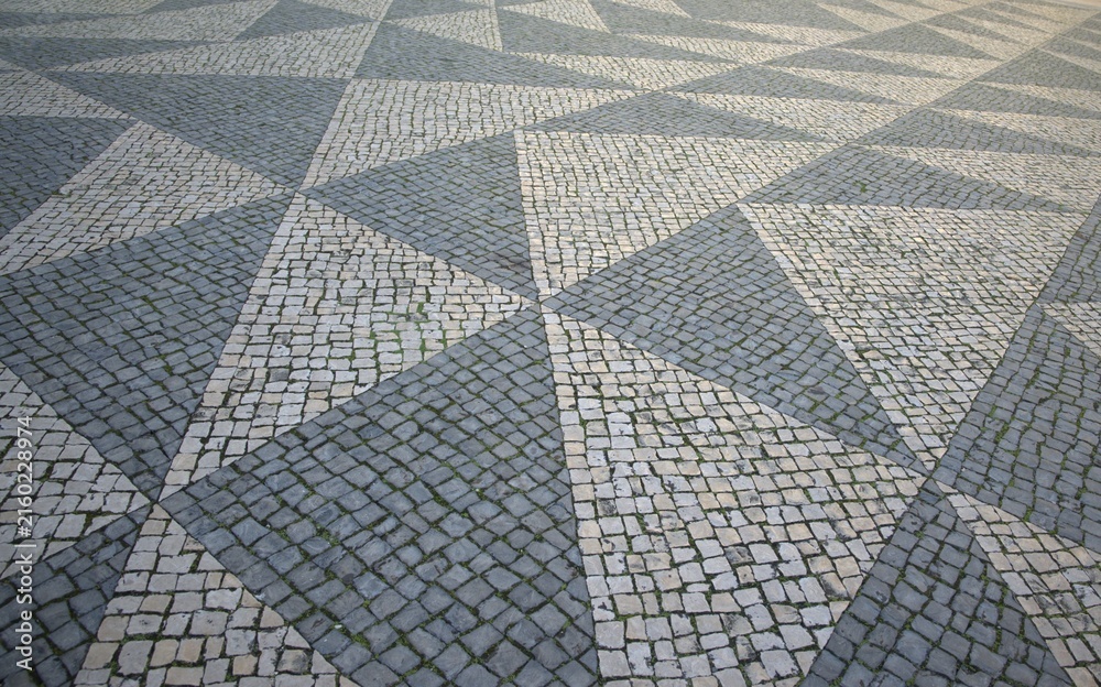 Obraz premium old stone pavement in lisbon
