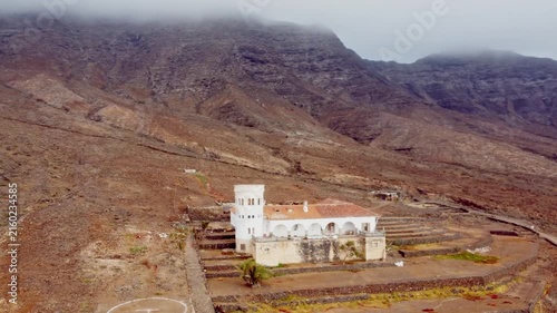 Casa winter aerial view flying away from the mysterious and lonely villa winter in a desolate fuerteventura valley
