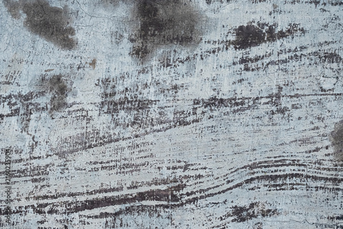 Old and moldy iron wall background. The surface of the white steel plate wall is moldy. The texture of the surface of the steel plate wall. Close-up view of an old, weathered wall surface