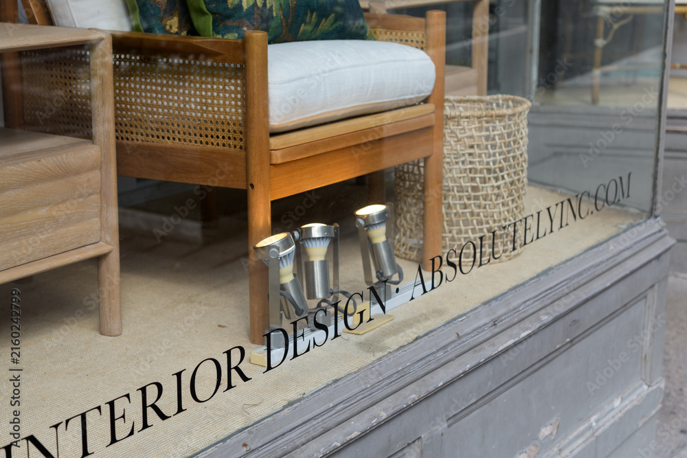 Fototapeta premium text at bottom of display window at Absolutely Inc, an interior designer, located at 1236 Yonge St, Toronto