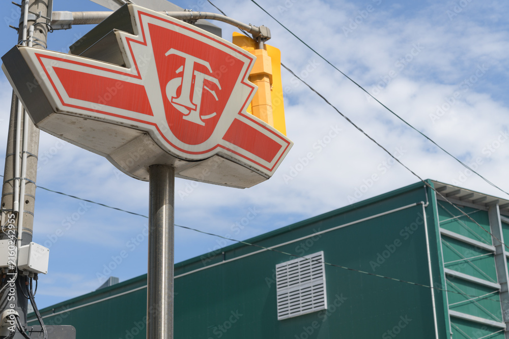 Fototapeta premium TTC insignia pylon outside entrance to Osgoode station, line 1, Toronto (University Av)