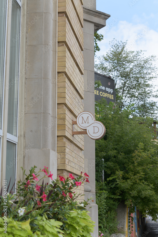 Fototapeta premium wall mounted projecting sign outside Summerhill MD, a medical spa, located at 1176 Yonge St, Toronto