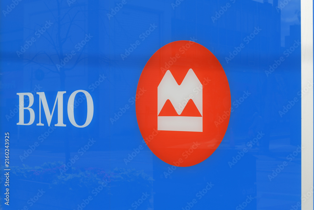 Fototapeta premium close-up of BMO Bank of Montreal sign and corporate logo on window at 1560 Yonge St, Delisle Court, Toronto