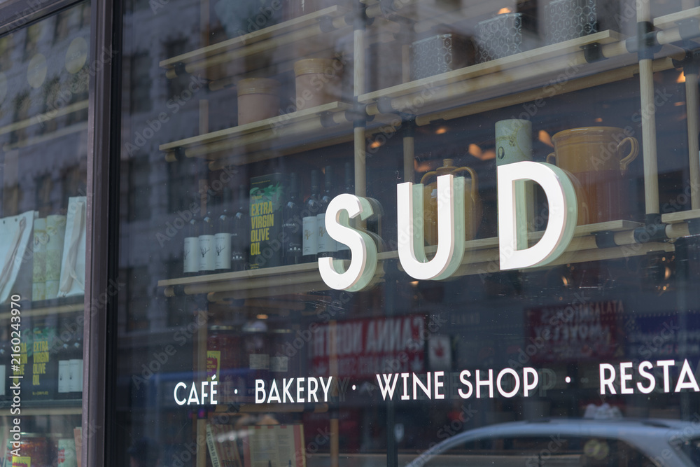Fototapeta premium channel lettering sign mounted to display window at Sud Forno, a restaurant, located at 132 Yonge St, Toronto