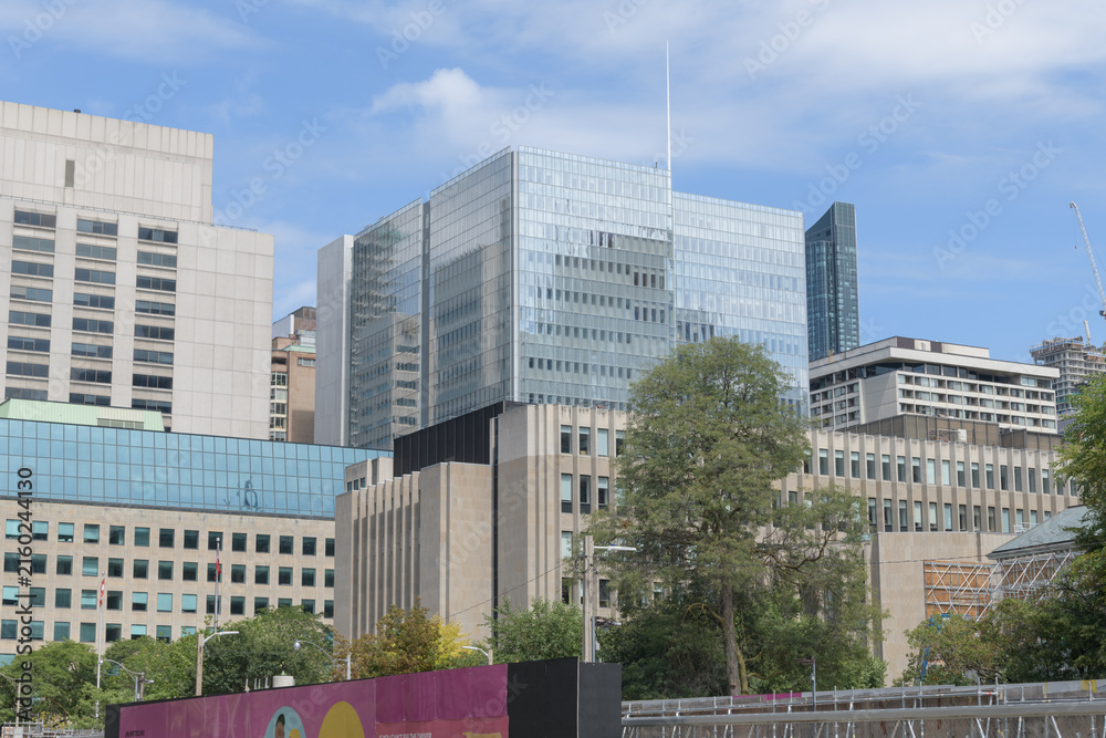 Fototapeta premium looking northeast on University Av to Ontario Court of Justice (glass building at center) and 361 University Avenue Courthouse (stone building bottom), Toronto