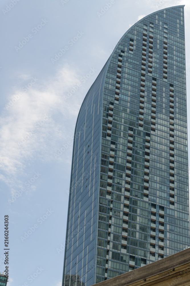 Fototapeta premium west elevation of L-Tower, designed by Daniel Libeskind (Page + Steele, IBI Group), a residential condominium tower, located at 8 The Esplanade, completed 2015 in Toronto