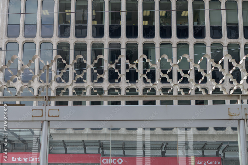 Naklejka premium decorative iron work at the 512 St Clair trolley transit stop, Yonge St, and a wide view of signage outside CIBC branch located at the Padulo Building St Clair Av W, Toronto