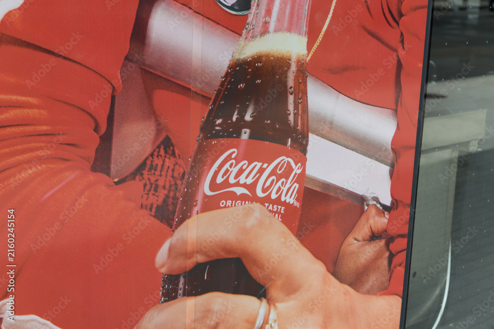 Naklejka premium mesh advertising banner at a convenience store for Coca-Cola, Toronto