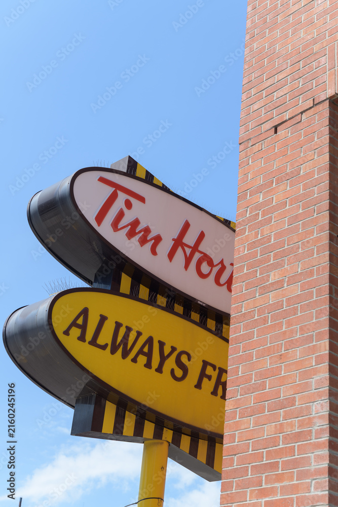 Fototapeta premium obstructed view of an iconic Tim Hortons pylon (Always Fresh oval background design) at 1728 Bloor St W, Toronto