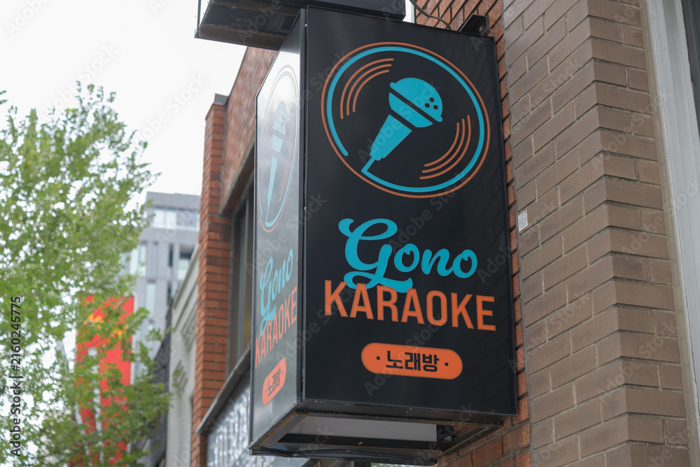 Fototapeta premium wall-mounted box sign outside GONO Karaoke, a bar, located at 2156 Yonge St, lower unit, Toronto