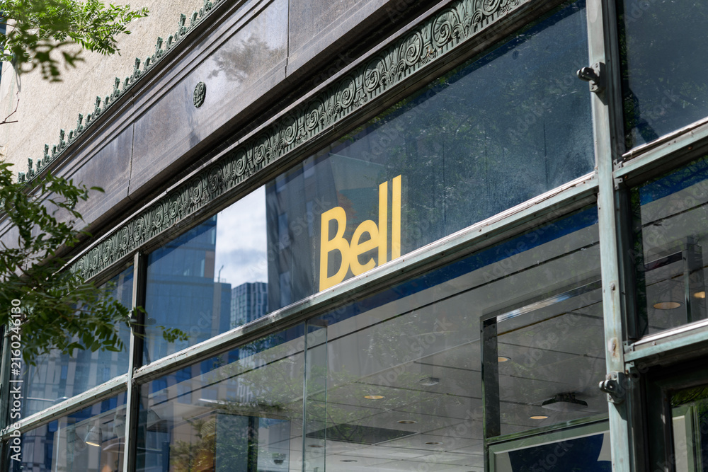 Fototapeta premium historic commercial building with sign of Bell, a telecommunications service provider, located at 444 Yonge St, College Park, Toronto
