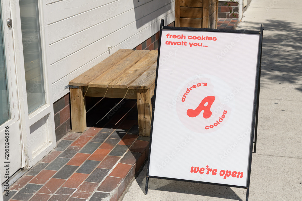 Naklejka premium a-frame sidewalk sign outside Andrea's Cookies, a cookie shop, located here at 1632 Bloor St W, Toronto