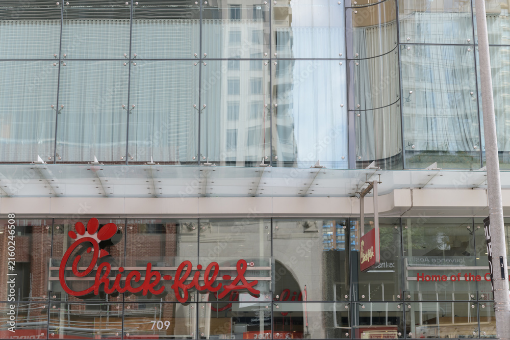 Naklejka premium exterior building facade and sign of Chick-fil-A, fast food restaurant chain, located here at 709 Yonge St inside One Bloor, Toronto