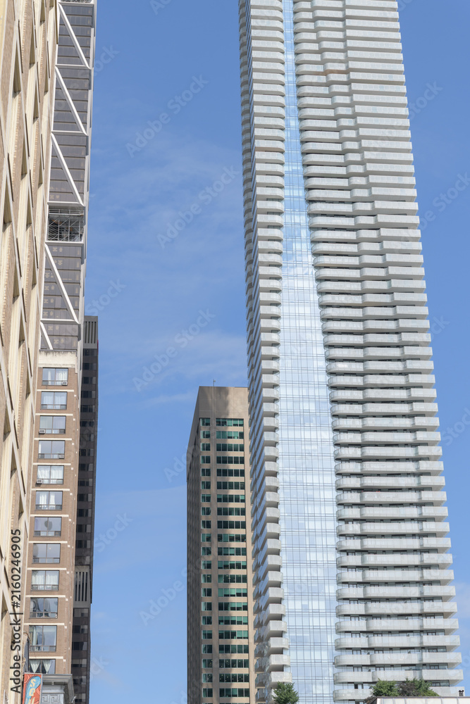 Naklejka premium (at right) view of One Bloor East designed by Hariri Pontarini Architects, a mixed-use commercial and residential tower at Yonge St, Toronto
