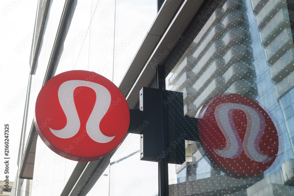 Fototapeta premium wall mounted projecting sign outside lululemon, a sportswear store, located at 2 Bloor St W (at Yonge), Toronto