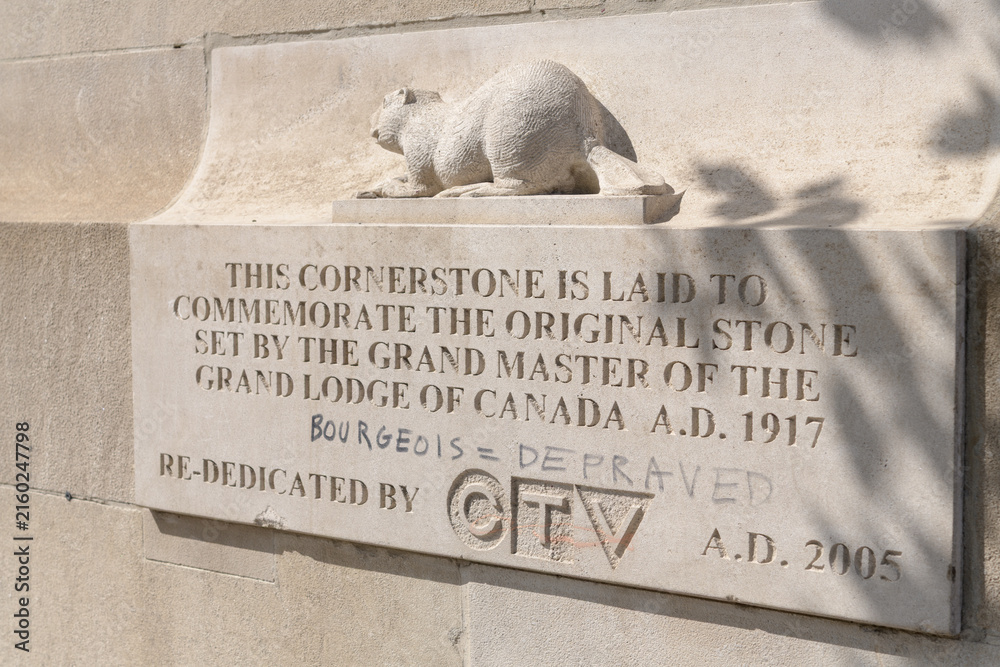 Fototapeta premium cornerstone dedication plaque with inscription at The Masonic Temple, designed by William F Sparling, completed 1918, and located at 888 Yonge St, Toronto