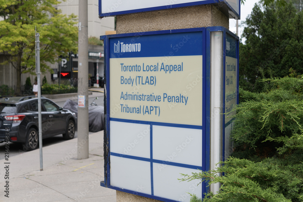 Fototapeta premium sign at the Toronto Local Appeal Body (TLAB) and Administrative Penalty Tribunal (APT) located at 40 Orchard View Boulevard, 2nd floor