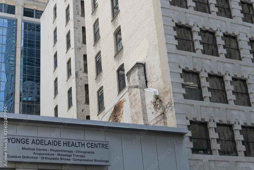 Fototapeta premium ghost sign of Yonge Adelaide Health Centre at 119 Yonge St, Toronto