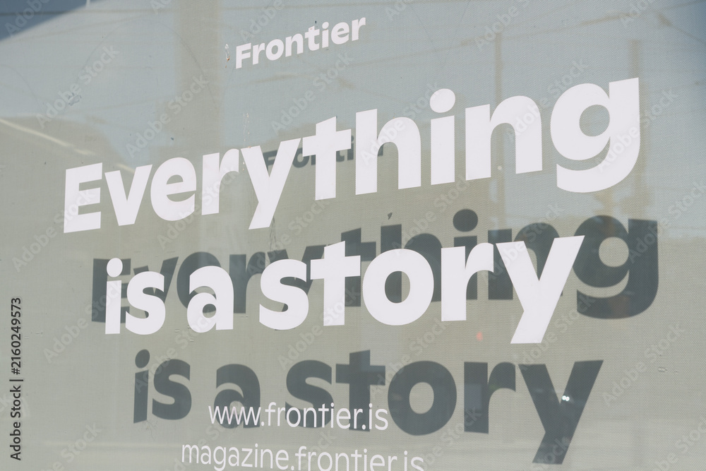 Naklejka premium vinyl window sign at Frontier, a design agency, located at 2208 Dundas St W, Toronto