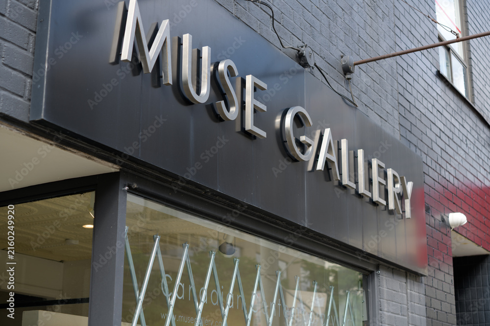 Fototapeta premium sign over display window and entrance to Muse Gallery located at 1230 Yonge St, Toronto