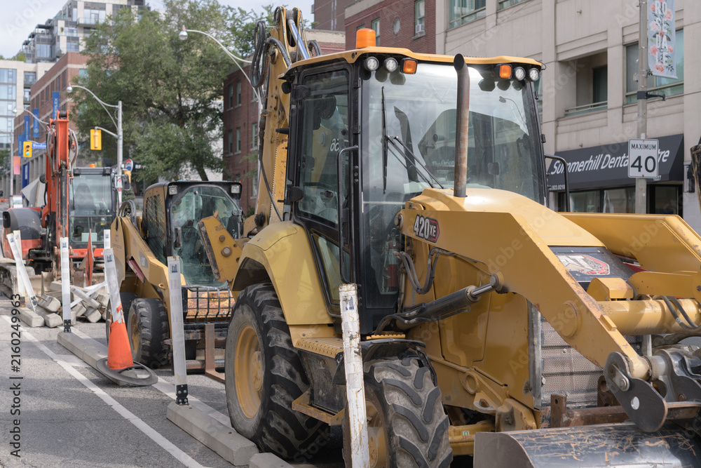 Fototapeta premium excavator on a construction site on Yonge St in Toronto