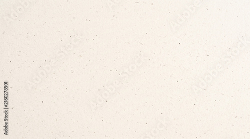 Neutral beige paper texture with visible fibers and speckles, offering a natural and organic feel, perfect for crafting or design projects.