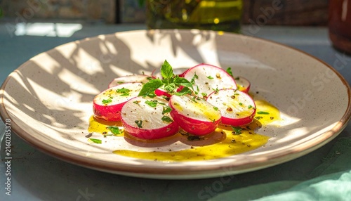 Fresh Caprese Salad with Radishes and Olive Oil Drizzle.