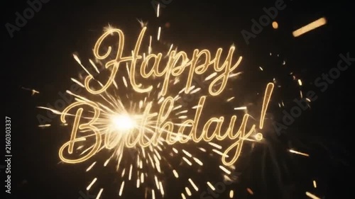 Happy Birthday Text Written with Glowing Sparklers and Smoke on Dark Night Background
