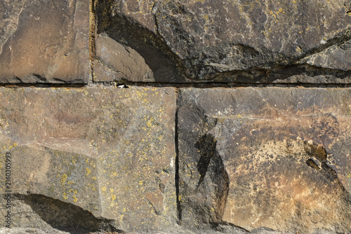 This is a fragment of a wall made up of large stone blocks in Warsaw, Poland