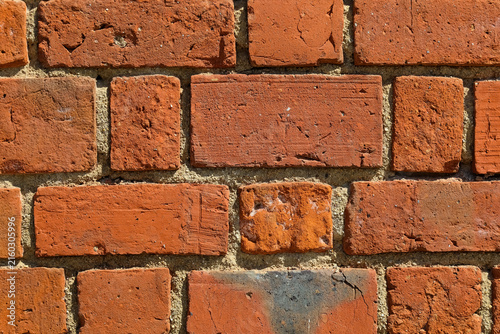This is a fragment of a red brick wall in Warsaw's Old Town in Poland