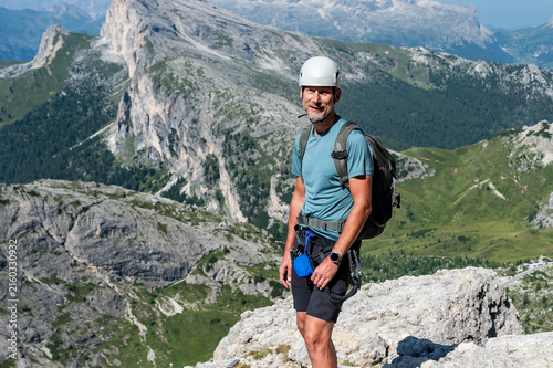 A man on the way to Monte Lagazuoi Piccolo. Alps, Dolomites, Italy.