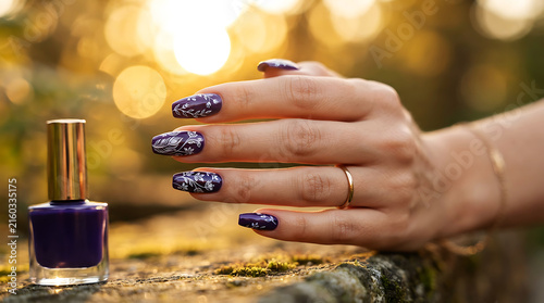 Hand displaying purple botanical capsules in palm