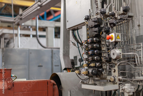 Quadro su tela Close-up of industrial hydraulic control system in tractor manufacturing plant