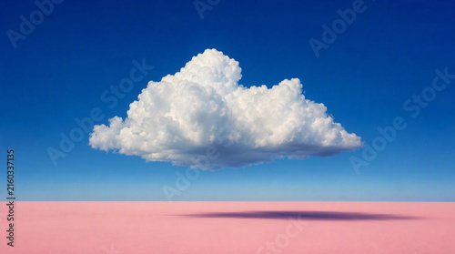 Surreal Abstract Concept of Single Fluffy Cloud Floating Over Pink Ground casting Shadow