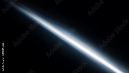 Blue Light Beam Streaking Across Black Background