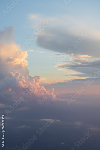 Puffy clouds at sunset aerial view