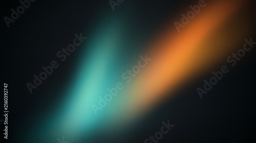 Abstract teal and orange light trails swirling in dark motion blur background