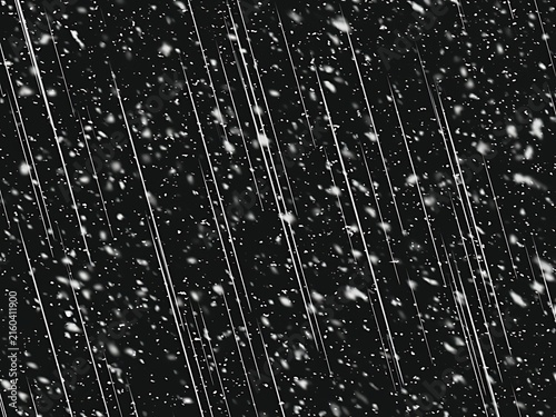 фотографія Snowfall during a storm at night with blurred light streaks against a dark backg