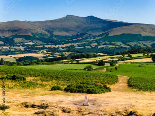 Bild auf Leinwand Elevated view of Pen y Fan peak from Mynydd Illtud, triangulation station in for
