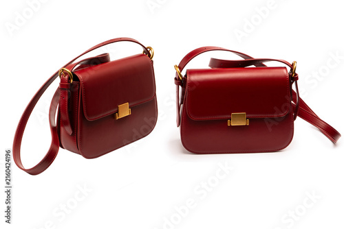 Burgundy shoulder leather bag isolated on white background.