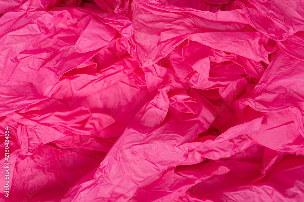 Fototapeta premium Pink and blue latex sterile medical gloves as a background.